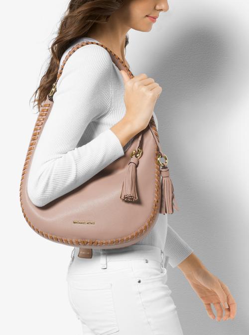 michaelkors什么牌子包包？michaelkors包包价格贵不贵？